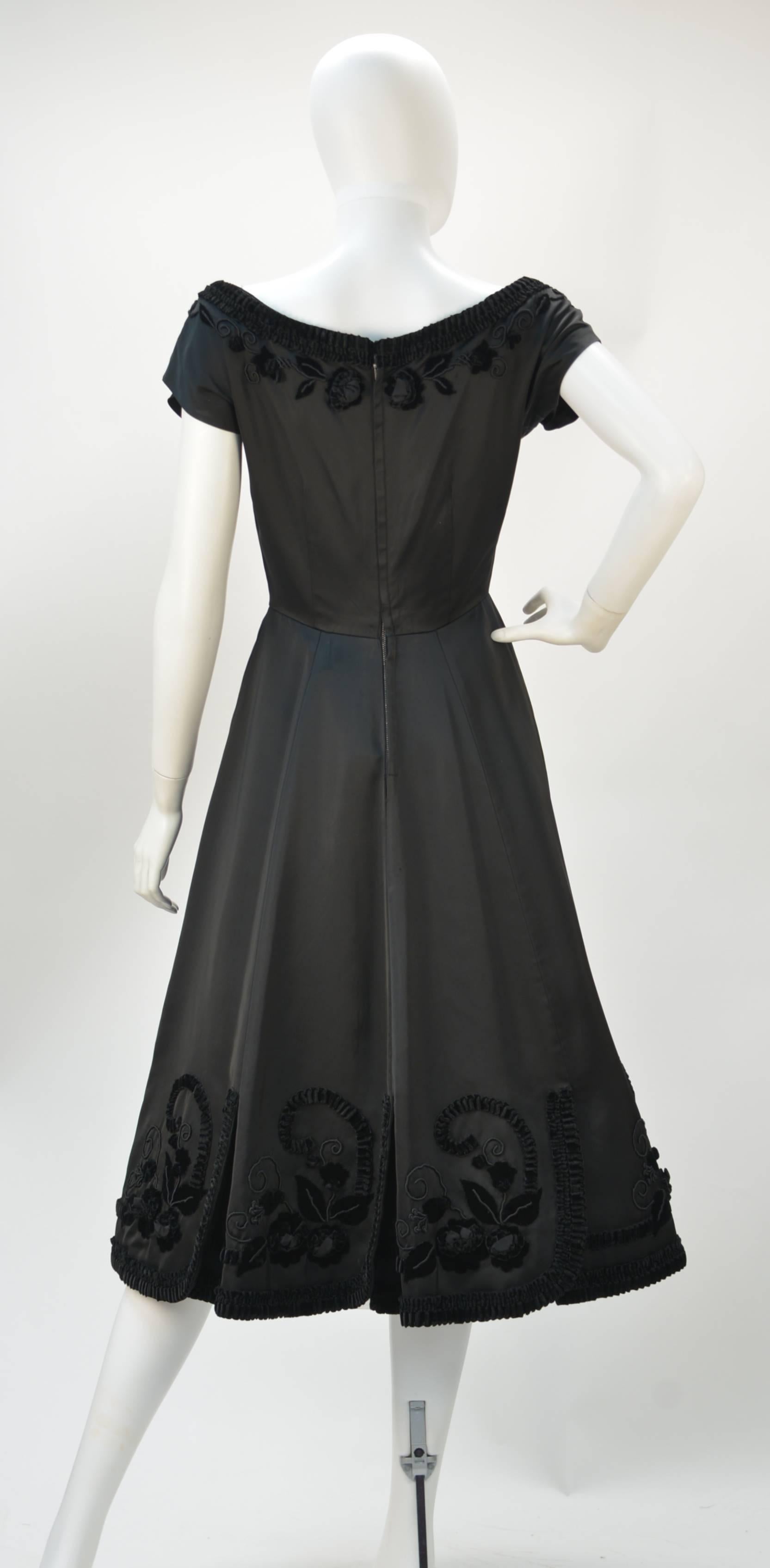 1950s Black Satin Party Dress with Velvet Trim and Floral Detail In Good Condition For Sale In Houston, TX