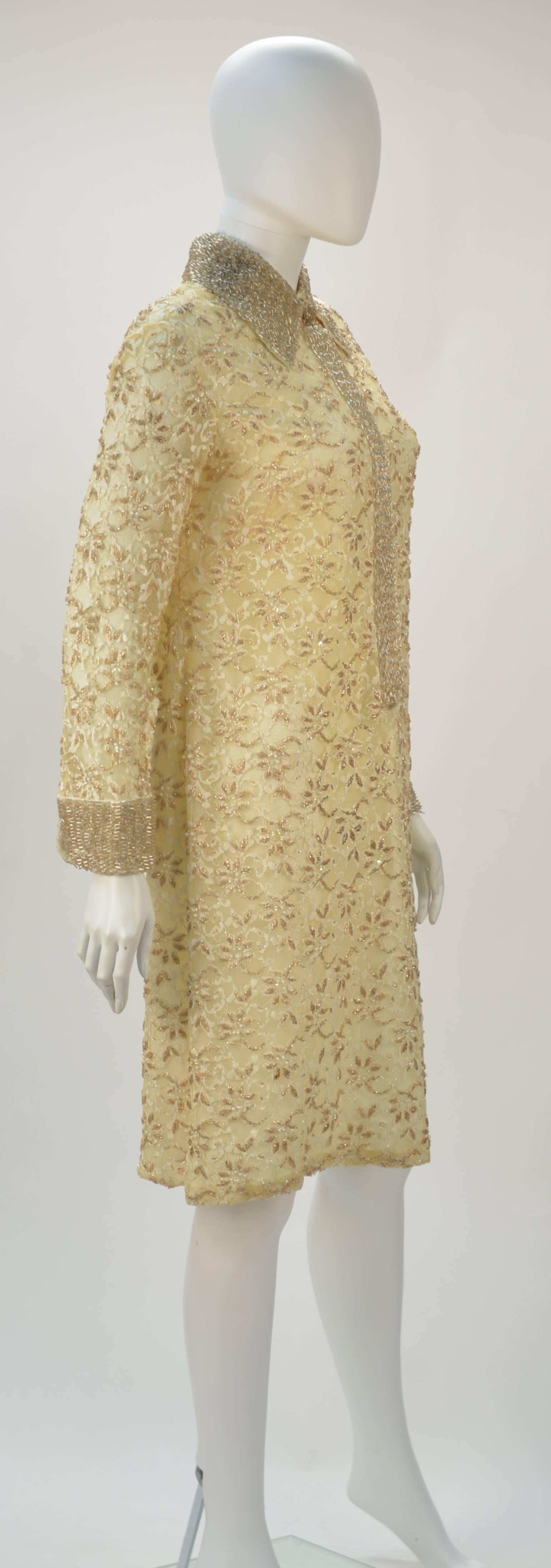 Refined 1960's cream beaded long sleeve tunic style cocktail dress by Valentina LTD. While difficult to see on a white background, Valentina's attention to detail and creative and intricate designs using beadwork make Valentina a coveted line to