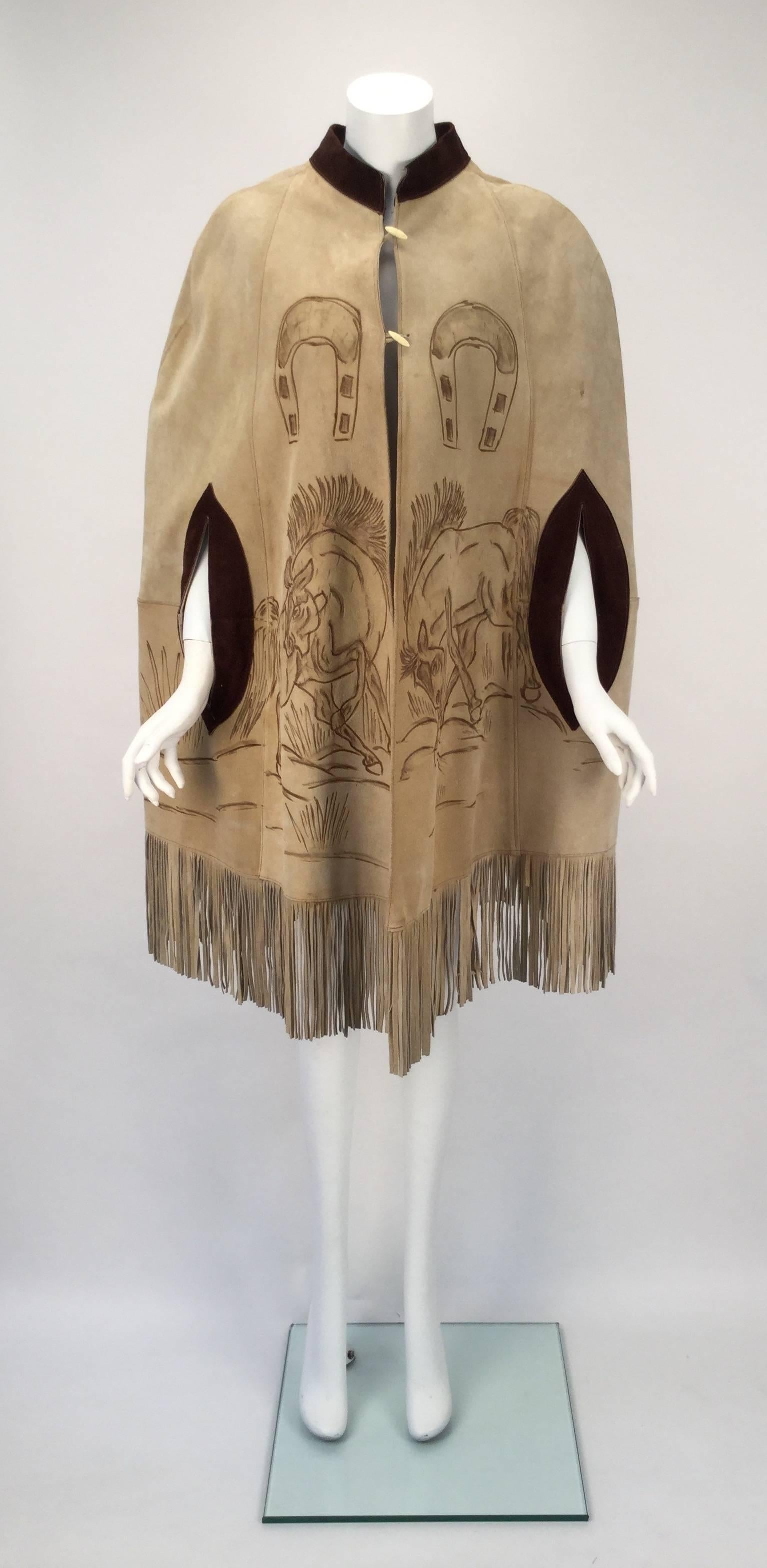 Gomez R hand drawn suede poncho, made in Guadalajara, Mexico. Gomez the brand was known for both its quality leather work and for drawing one of a kind scenes. This amazing poncho features a galloping horse and horseshoe scene. The poncho has a