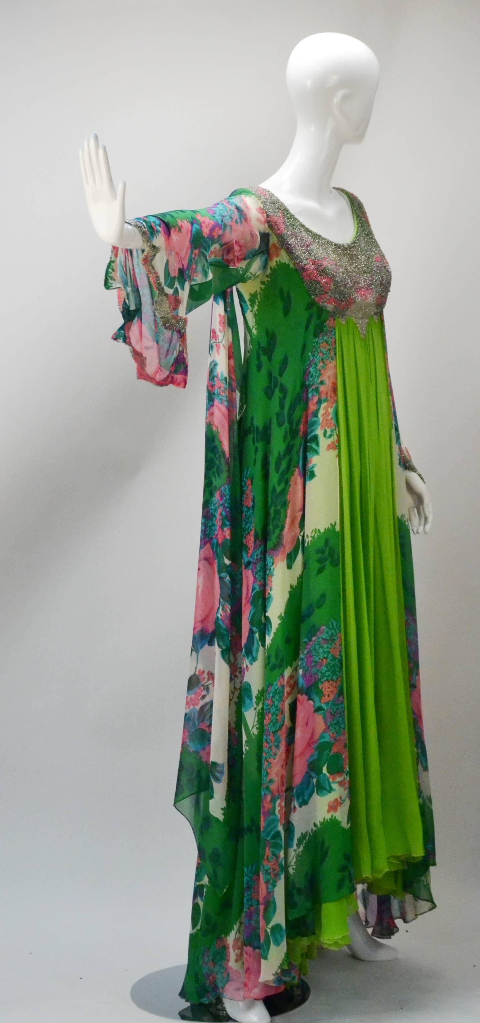 Channel your ethereal goddess wearing this jaw dropping floor length gown.

Gown is light in all but color (and weight) with its varying hues of green and pink and floral patterning in those colors as well.  The massive hand beadwork beaded in
