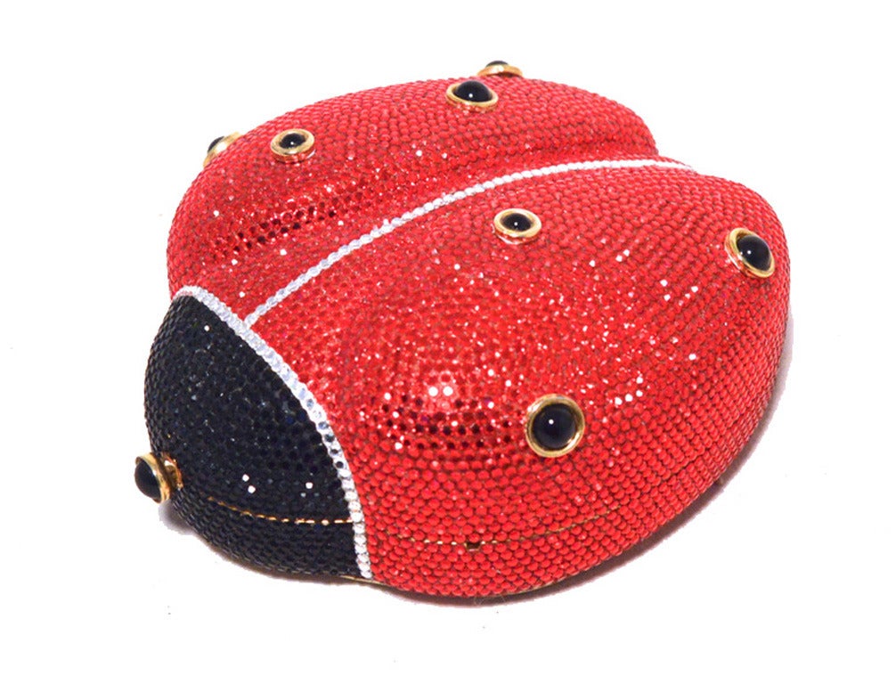 STUNNING JUDITH LEIBER ladybug minaudiere in MINT condition.  Swarovski crystal exterior in red, clear, and black crystals over a gold structure with a gold leather bottom base.  Push button top closure opens to a gold leather lined interior that