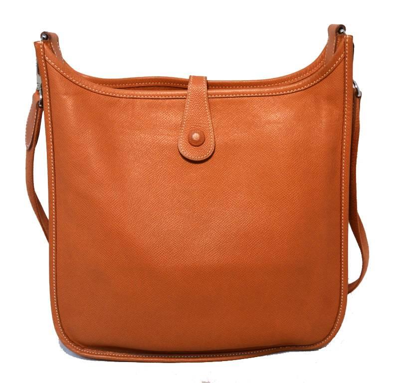 Classic Hermes Evelyne I PM shoulder bag in excellent condition.  Natural tan epsom leather with silver palladium hardware.  Snap strap closure opens to an unlined interior that holds enough storage space for your essentials and one side slit