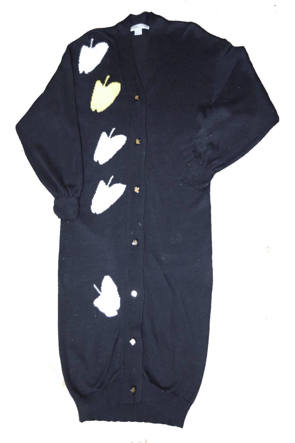 Hanae Mori navy blue long knit cardigan with apple print along front and back.  White apples compliment the navy design with one yellow apple to offset the entire look. 7 button front closure.  100% cotton. Ribbed hemlines. Dolman style sleeves.
