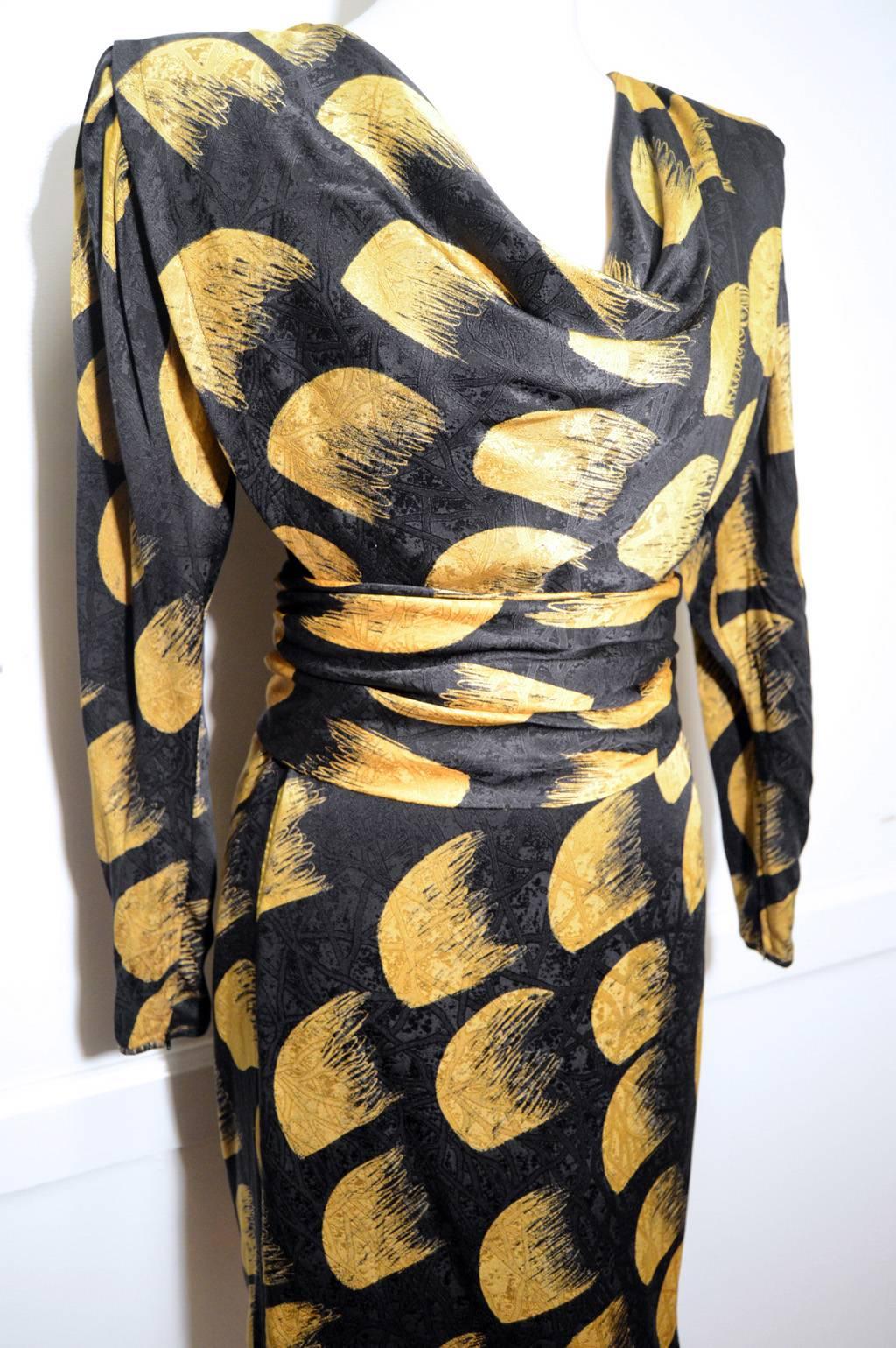 1980s Emanuel Ungaro Parallele Paris silk dress.  Black silk with unique yellow brush stroke style print.  matching ruched buttoned belt included.  Wide shoulder design with Front triangle panel that can be worn lose or tucked into belt. Tagged size