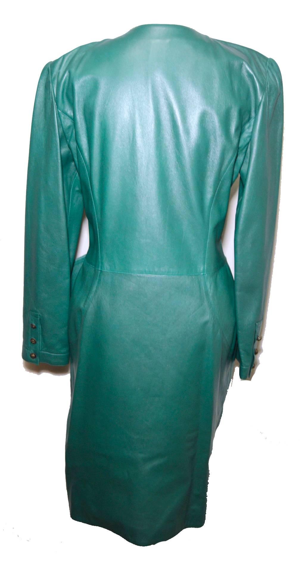 Gorgeous green leather wrap dress by Ungaro from the 1980s.  100% genuine leather. Wrap dress style with 10 side front bronze button closures. Unique angled leather detail along front side skirt panel.  2 front pockets. Fully lined with matching
