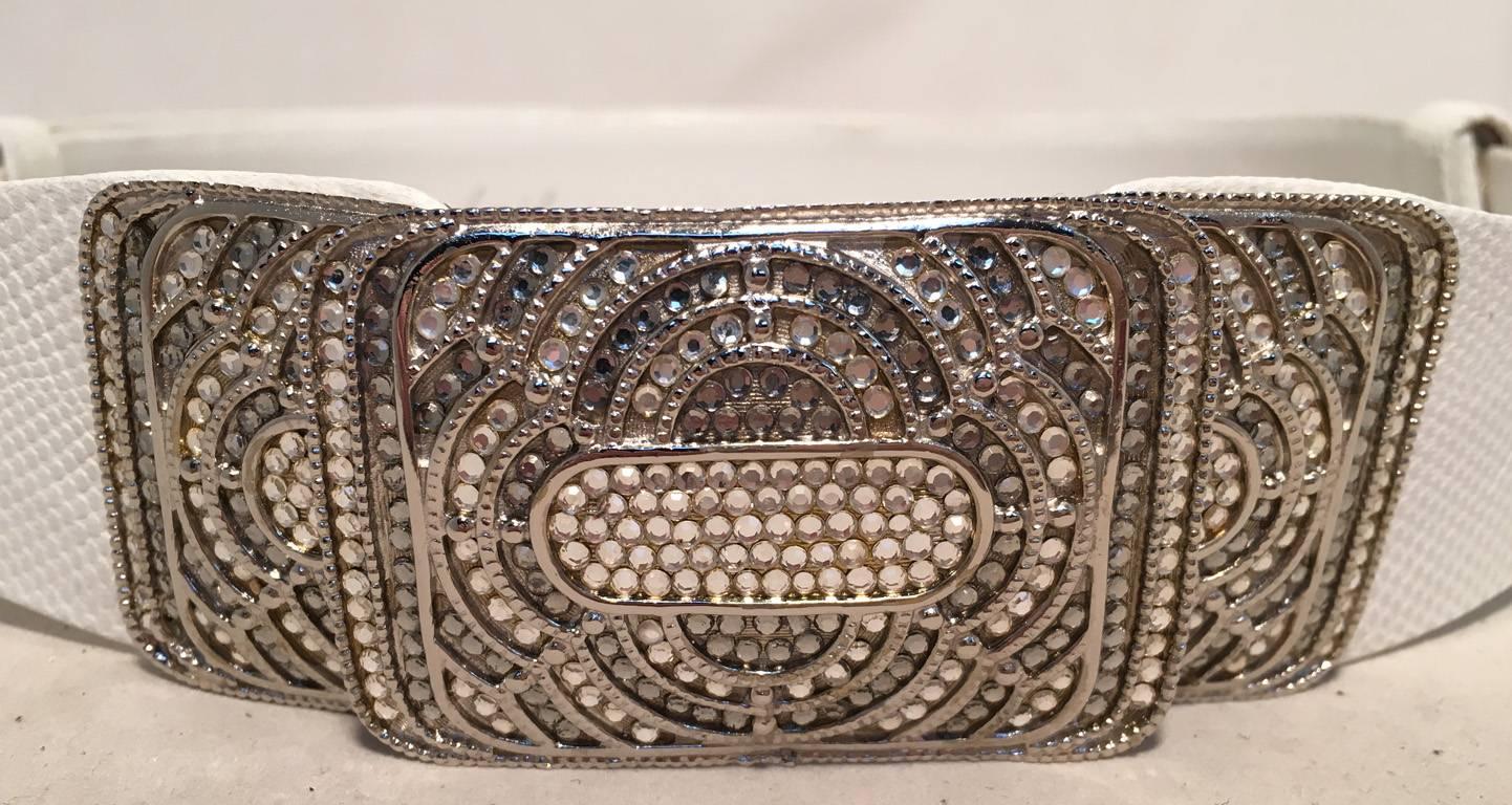 BEAUTIFUL Judith Leiber vintage white leather belt in excellent vintage condition.  White leather belt that can be adjusted to fit various waist and hip sizes. Front silver buckle closure adorned with rhinestones in a stunning art nouveau design. No