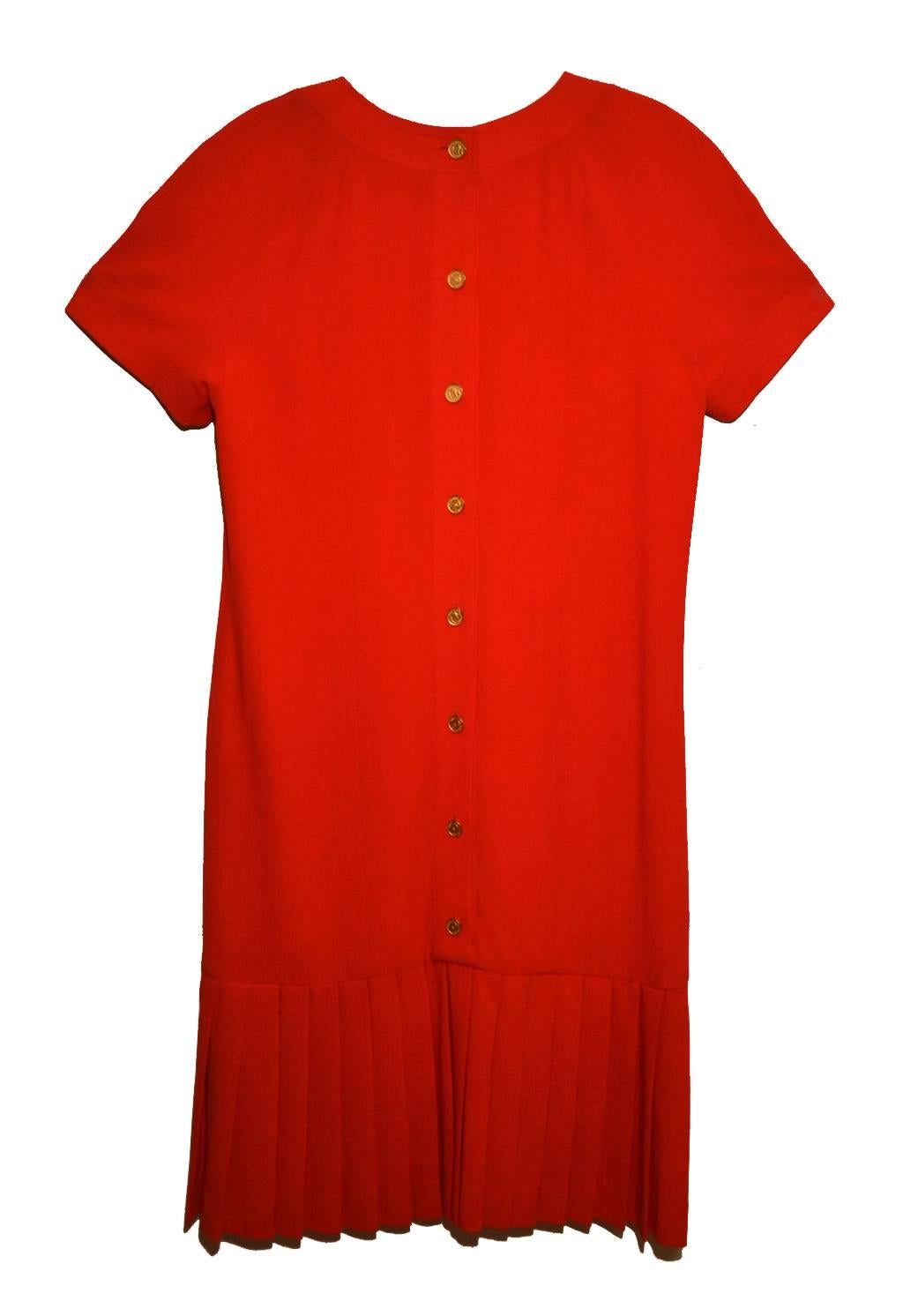 Rib weave, rayon blend dress.  Dress has four front pockets with Chanel button and 11