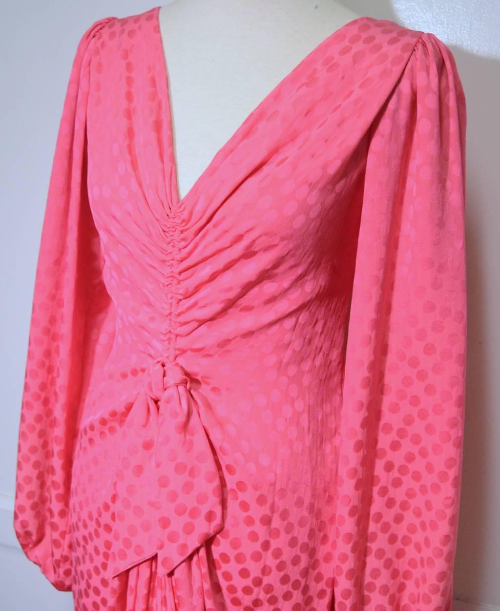 Vibrant pink silk dress by Eric Y Juan c1980s.  Bubblegum pink silk with woven polka dot design. Ruched front with bow at waist. V neck and back. 13