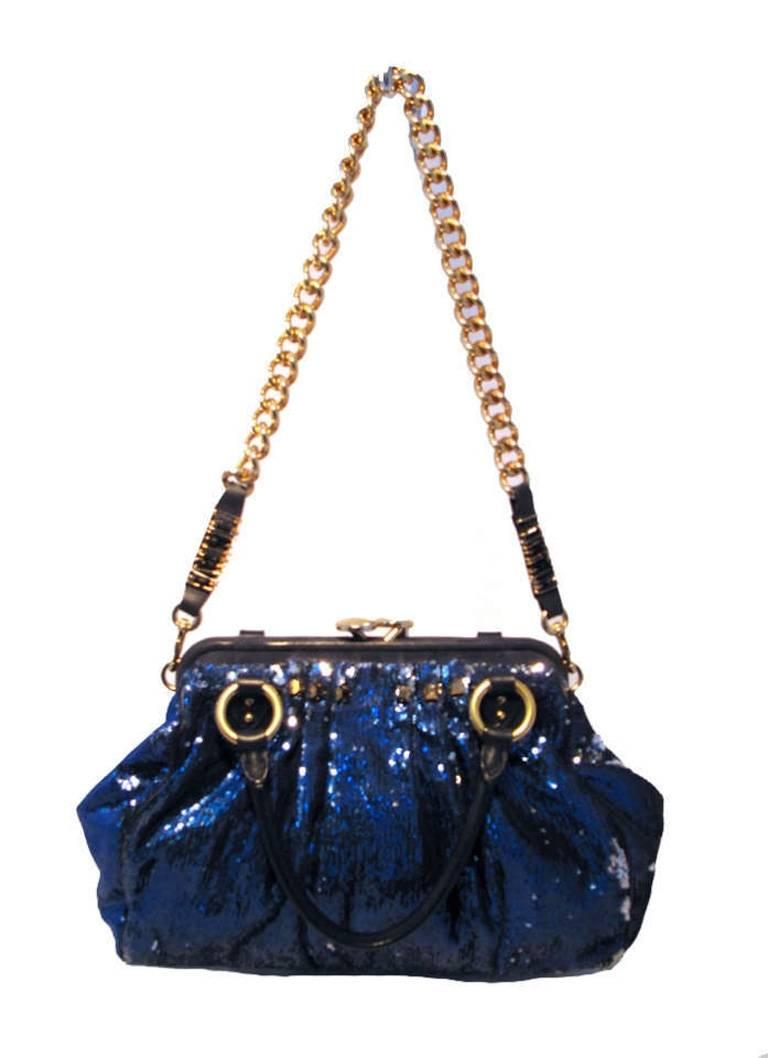 STUNNING MARC JACOBS New York Rocker Sequin Stam Bag in Very Good condition. Blue sequin exterior with black leather and gold hardware. Removable gold chain shoulder strap converts this piece between shoulder and hand styles easily. Oversized