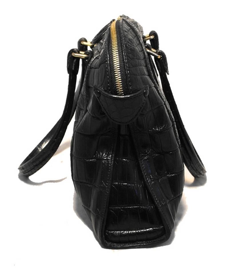 Absolutely Stunning Zagliani black alligator handbag in excellent condition. Black alligator leather exterior trimmed with gold hardware. Double zipper top closure opens to an unlined interior that holds 1 side zippered pocket and ample storage