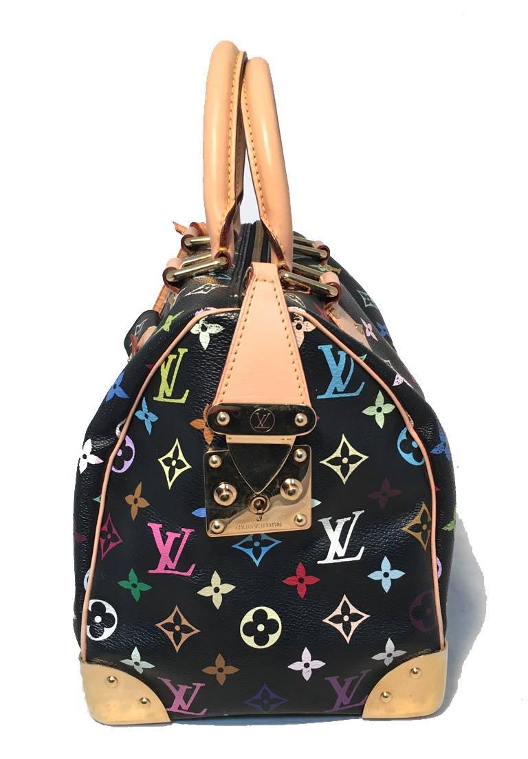 Limited edition black Louis Vuitton monogram Murkami speedy in very good condition.  Black monogram canvas exterior trimmed with tan leather and gold hardware.  Front flap pocket with pinch latch closure.  Gold bottom corner details to help protect