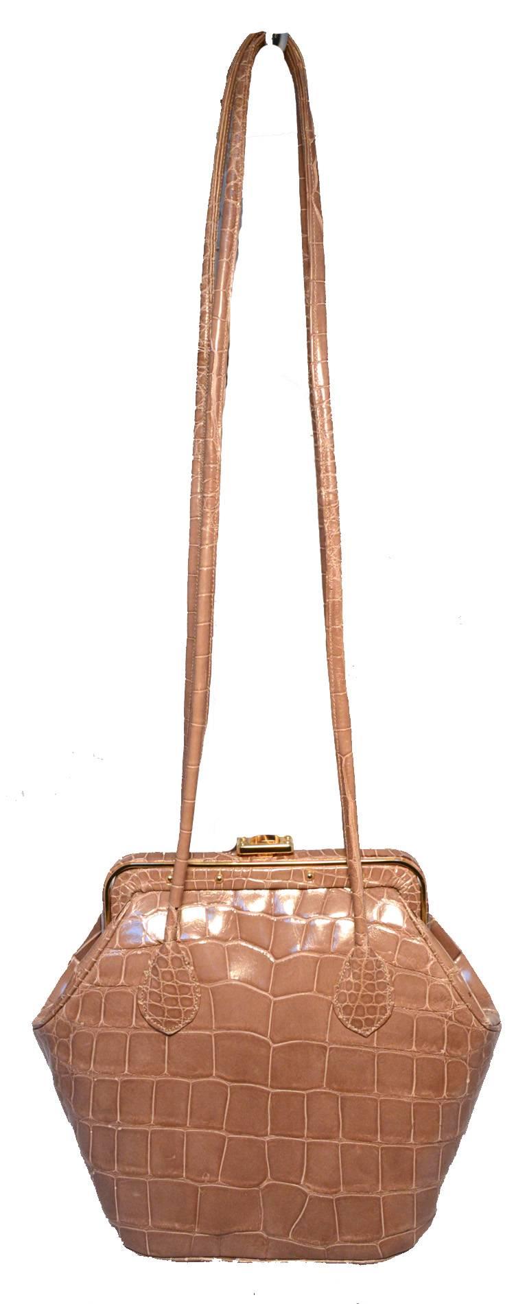 BEAUTIFUL Judith Leiber vintage alligator shoulder bag in excellent condition.  Taupe alligator leather exterior trimmed with gold hardware, double shoulder straps, and top tigers eye button closure.  Leather lined interior holds 2 slit side