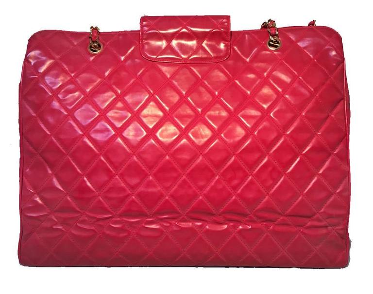 GORGEOUS VINTAGE CHANEL red model tote in very good condition.  Red quilted PVC with woven chain and leather handles and shining gold hardware.  Front twist CC logo closure opens through a top flap to 2 exterior large side slit pockets and one extra
