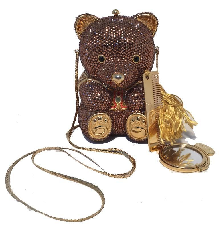 ADROABLE Judith Leiber teddy bear minaudiere in excellent condition.  Brown swarovski crystal exterior with multicolore crystals on vest, Black semi precious stone eyes and gold form body throughout.  Gold leather base.  Top button closure opens to