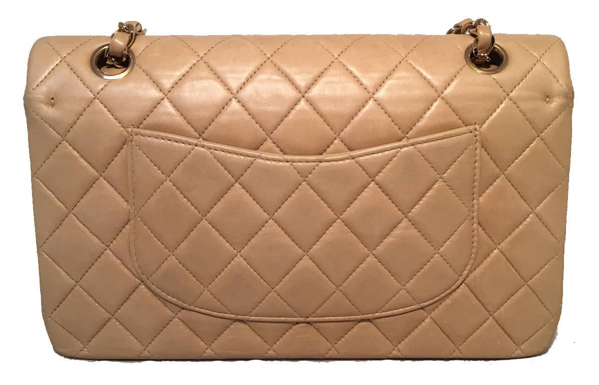 AMAZING CHANEL tan leather 2.55 double flap classic in excellent condition.  Neutral tan leather lambskin exterior trimmed with gold hardware and signature woven chain and leather shoulder strap that can be worn doubled (shorter) or single (longer).