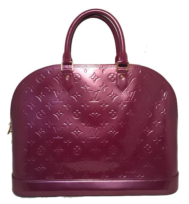 STUNNING LOUIS VUITTON purple vernis monogram alma bag in excellent condition.  Beautiful purple vernis leather with embossed monogram design trimmed with gold hardware.  Clochette with keys and lock attached. Full double zipper closure opens to a