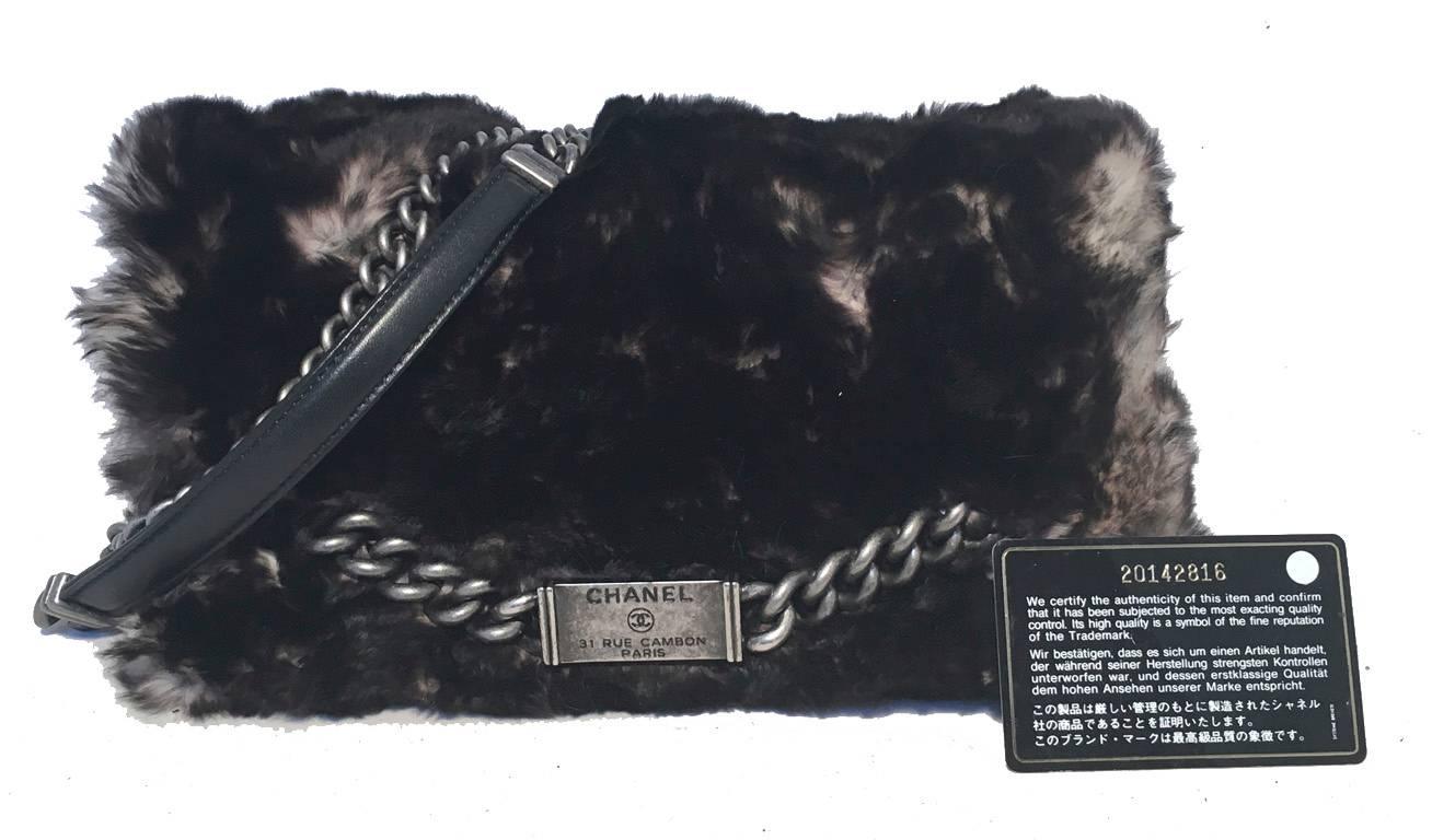 STUNNING CHANEL chinchilla fur classic flap in excellent condition.  Black and grey extremely soft chinchilla fur exterior trimmed with antiqued silver hardware and black leather sides and base. Chain shoulder strap can be worn short or long to suit