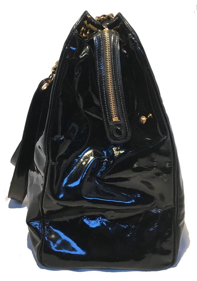 GORGEOUS Chanel patent leather model tote in excellent condition.  Black patent leather exterior with gold hardware and CC Chanel logo quilted on back.  Double leather and chain shoulder straps.  Front twist XL CC logo closure opens to 2 side