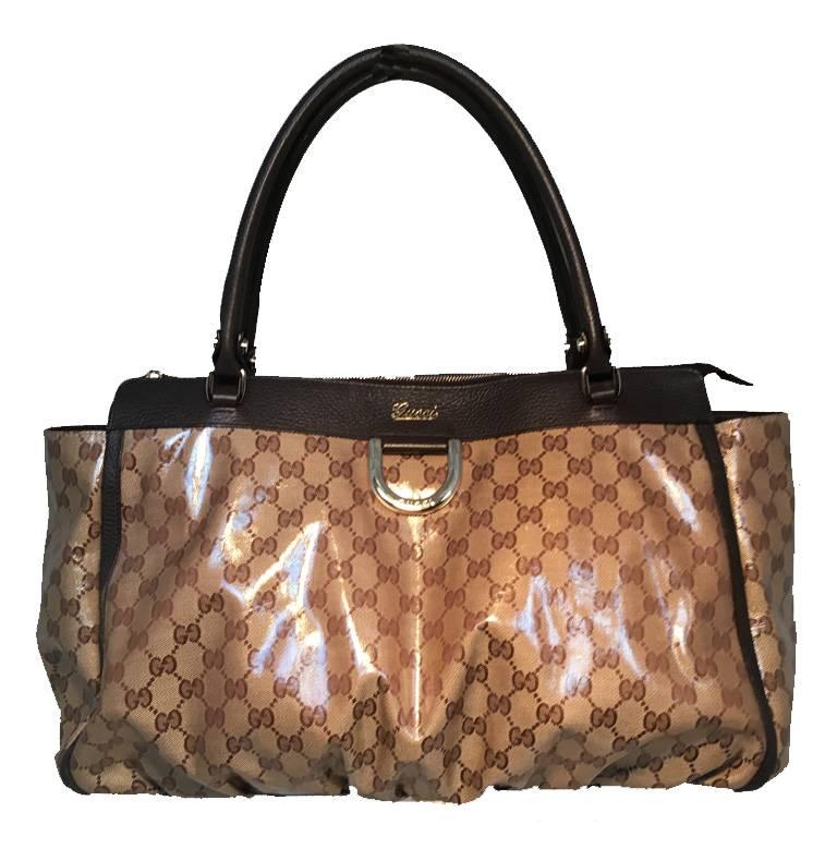 BEAUTIFUL Gucci coated canvas ruched bottom tote bag in excellent condition.  Coated monogram canvas exterior trimmed with dark brown leather and gold hardware.  Coated canvas is durable and long lasting making this piece a must-have for every