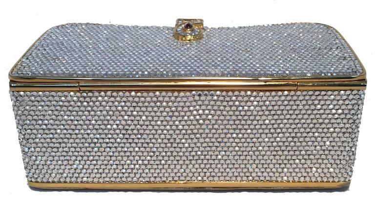 BEAUTIFUL Vintage Judith Leiber Swarovski crystal box minaudiere in excellent condition.  Gold box form with clear Swarovski crystals surrounding the exterior.  Gold padded leather exterior base.  Front top lift closure opens to a gold leather lined