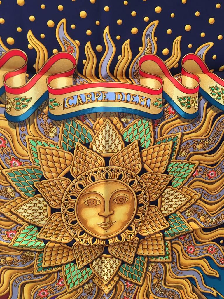 RARE Hermes Carpe Diem Silk scarf in excellent vintage condition.  Original silk screen design c1994 by Joachim Metz features a beautiful intricate sunburst centered design with a mythological theme throughout.  Deep navy blue background with