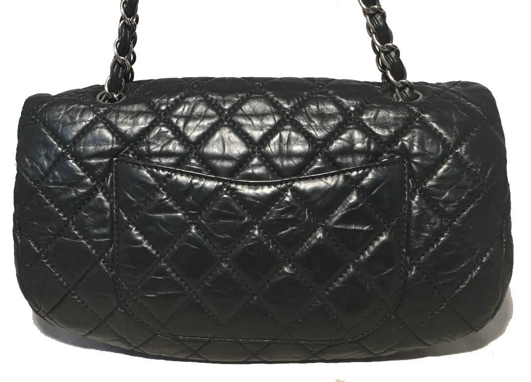 GORGEOUS CHANEL black distressed leather classic flap shoulder bag in excellent condition.  Quilted black distressed leather exterior trimmed with silver hardware and signature woven chain and leather shoulder strap.  Front snap closure opens via