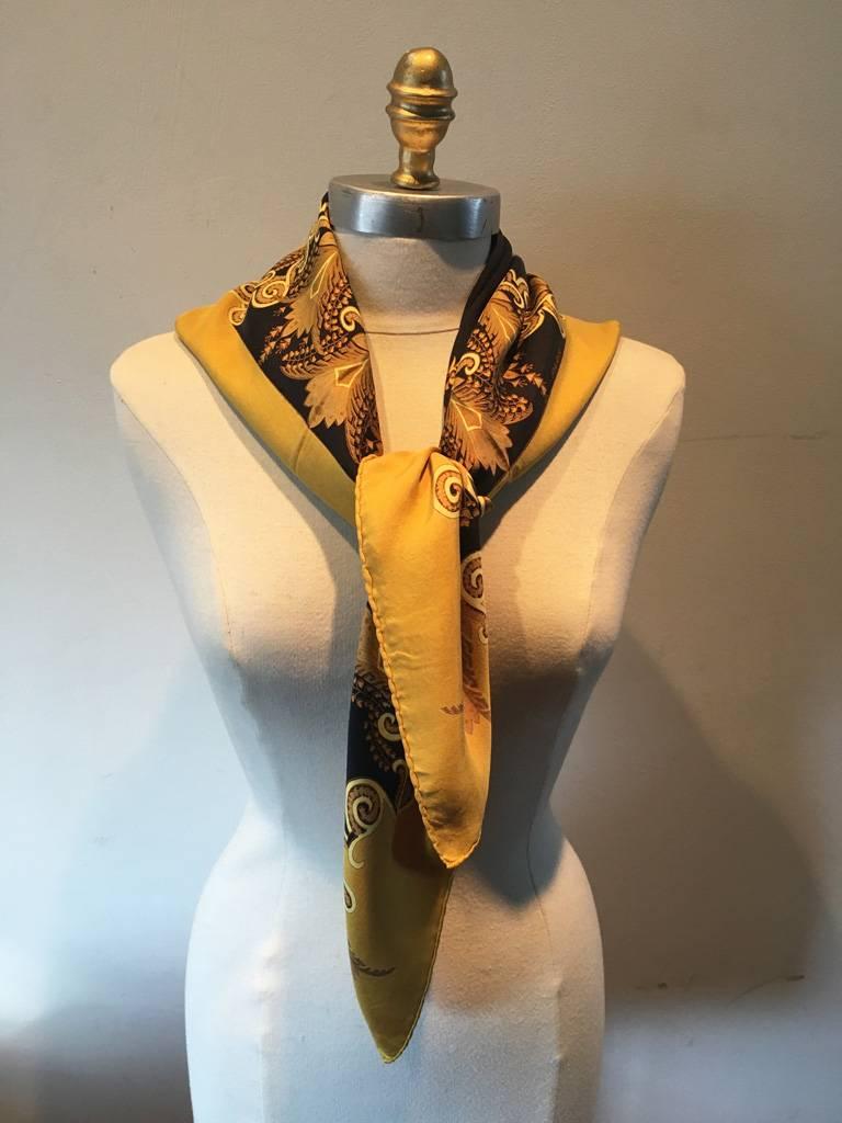 GORGEOUS VINTAGE HERMES Fantaisie silk scarf in black and gold in excellent condition.  Original silk screen design c1973 by Henri d'Origny features a whimsical design of loops and flourettes in various tans and golds over a black background with a