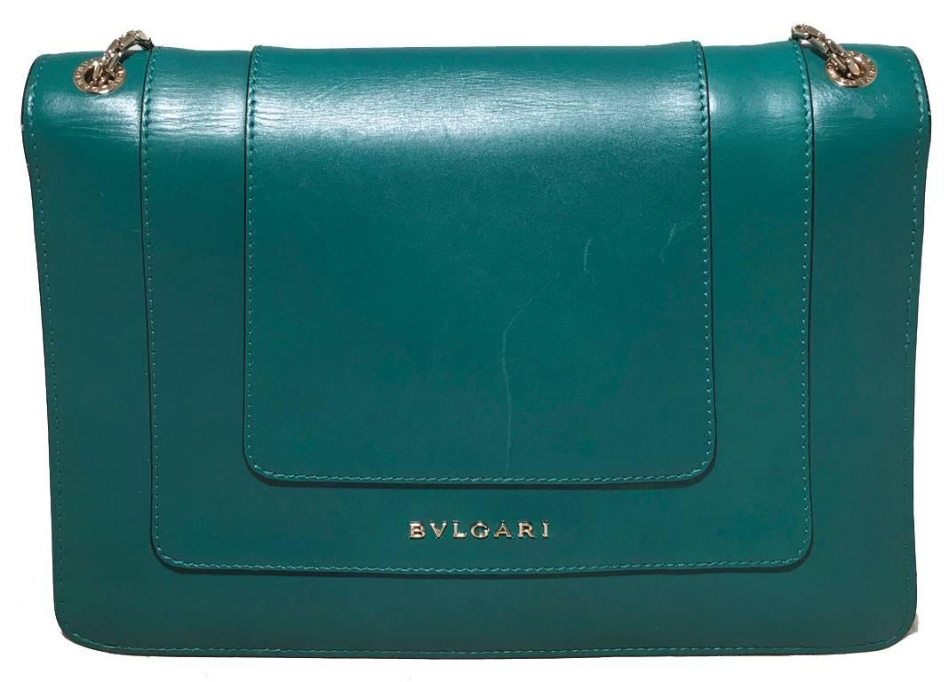 RARE Bulgari green leather shoulder bag in excellent condition.  Soft jade green leather exterior trimmed with double gold chain shoulder straps and a bejeweled snake head clasp closure.  Snake head clasp composed of black and white enamel with gold