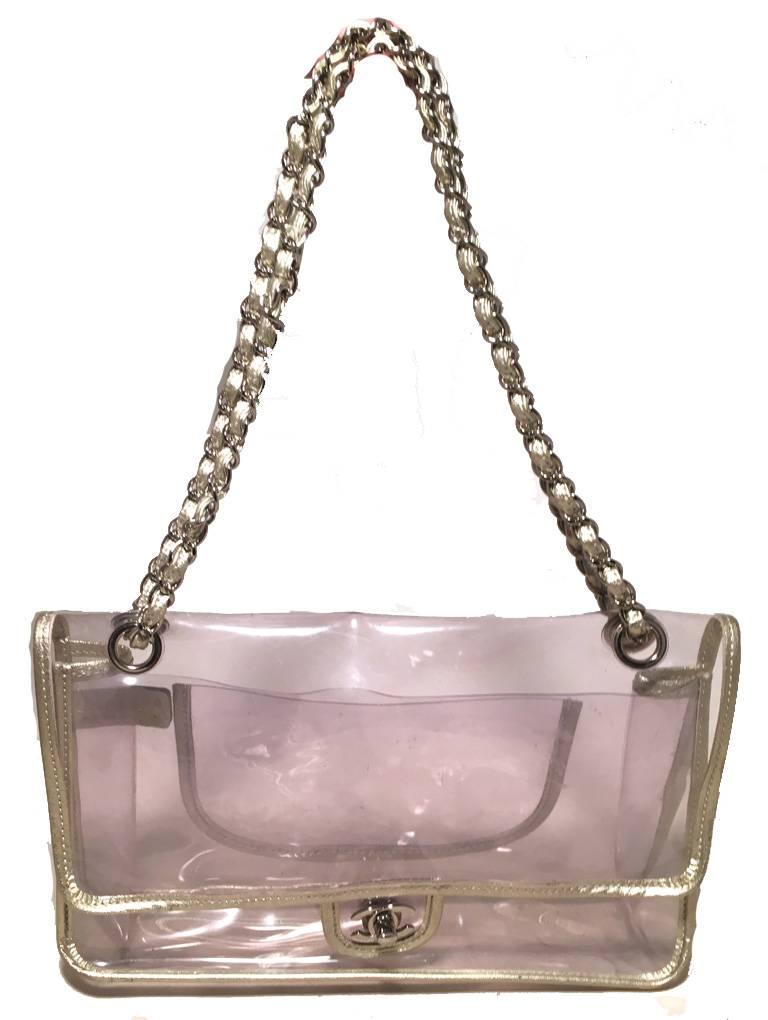 GORGEOUS Chanel clear classic flap shoulder bag in excellent condition.  Clear vinyl trimmed with gold leather and hardware.  Woven chain and leather shoulder straps can be worn short or long to suit your style.  Front CC twist logo closure opens to