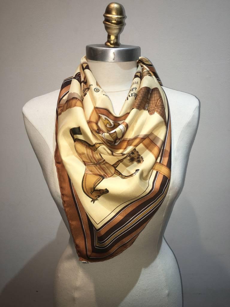 BEAUTIFUL Hermes couvetures et tenues silk scarf in tans in excellent condition.  Original silk screen design c1974 by Jacques Eudel features an array of dressed horses in various neutral colors. 100% silk, hand rolled hem. made in France.  original