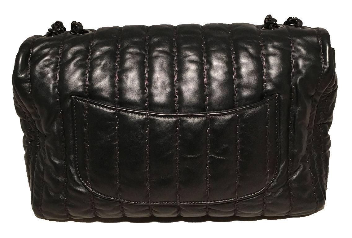 AMAZING Chanel stripe quilted shimmery leather classic flap shoulder bag in excellent condition.  Black subtly shimmery leather exterior with thick shimmery topstitching quilted in a stripe pattern.  Gunmetal hardware and signature woven chain and