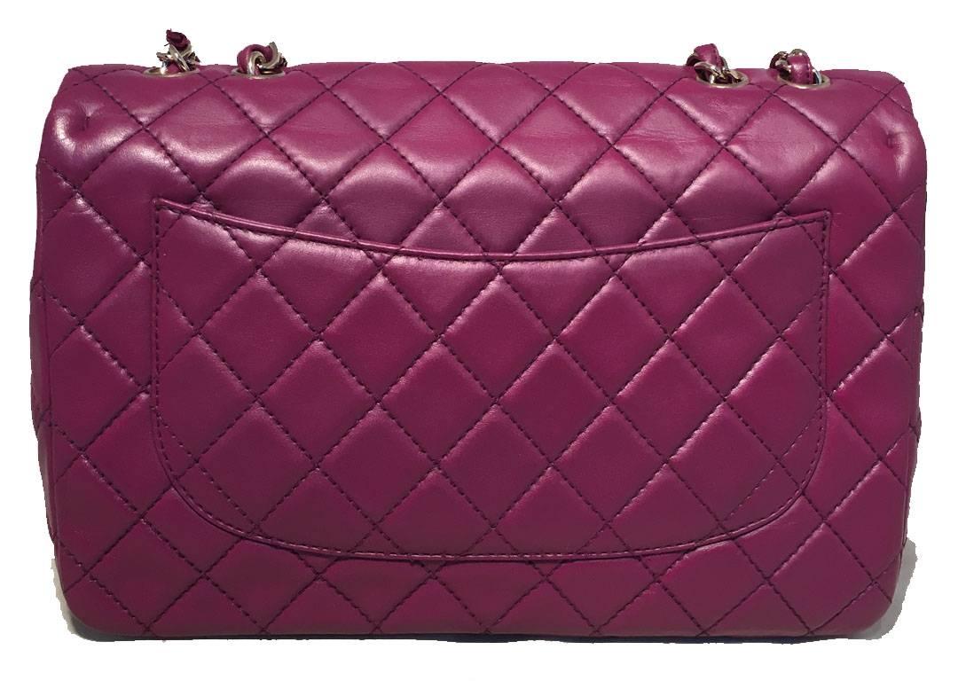 AMAZING Chanel purple leather jumbo classic flap in excellent condition.  Quilted purple lambskin leather exterior with gold hardware and heavy dark purple topstitching.  Signature woven chain and leather shoulder strap can be worn short or long to
