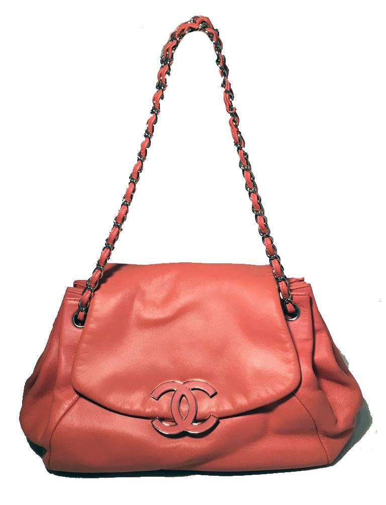 GORGEOUS Chanel coral leather top flap shoulder bag in excellent condition.  Coral leather lambskin leather exterior trimmed with silver hardware.  Signature woven chain and leather shoulder straps. Front CC leather logo lifting closure opens to a