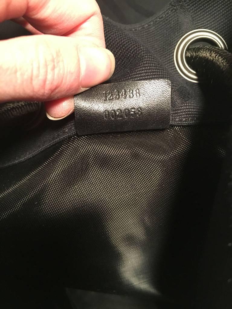 RARE Gucci Black GG Monogram Canvas Sling Backpack Bag In Excellent Condition For Sale In Philadelphia, PA
