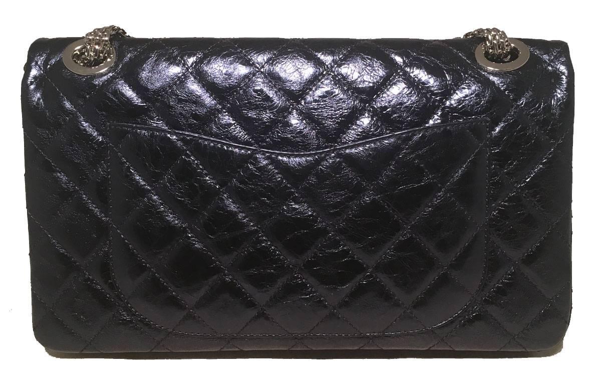 RARE Chanel 2.55 reissue classic flap Maxi in excellent condition.  Metallic blue quilted distressed leather exterior trimmed with silver hardware.  Mademoiselle style twist front closure opens via double flap to matching metallic blue leather lined