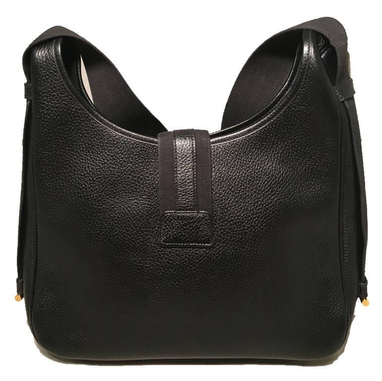 GORGEOUS Hermes vintage black leather shoulder bag in very good condition.  Black clemence leather exterior trimmed with a woven canvas shoulder strap and gold hardware.  Top snap strap closure opens to a black leather lined interior that holds 1