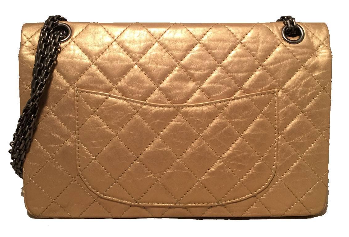 GORGEOUS Limited edition Chanel gold 2.55 reissue 226 double flap classic in excellent condition.  Quilted distressed gold leather exterior trimmed with gunmetal hardware.  Mademoiselle style twist closure opens to a gold and beige leather lined