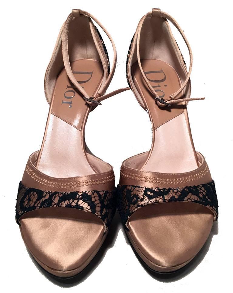 BEAUTIFUL Christian Dior satin and lace ankle strap heels in very good condition.  Blush satin body with black lace trim upon heels and toes. Open toe design with ankle strap feature and closed back heel. Beige and tan leather lining. Natural tan