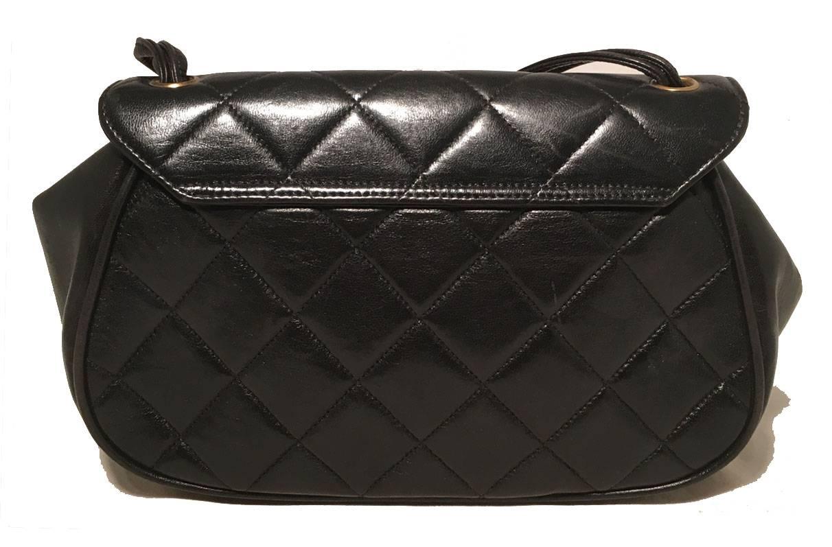 BEAUTIFUL Chanel Vintage quilted black leather top flap classic handbag in excellent condition.  Black lambskin leather exterior with signature diamond quilted pattern along front, back, and top flap.  Knotted double rope style handle.  Gold