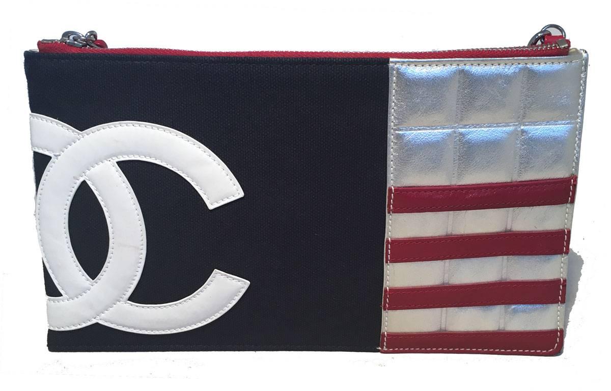 AMAZING Chanel USA Red White and Blue Patriotic Pouchette clutch in excellent condition.  Navy blue canvas trimmed with white CC logo, red patent leather stripes and quilted silver leather exterior with a woven chain and leather handle.  top zipper