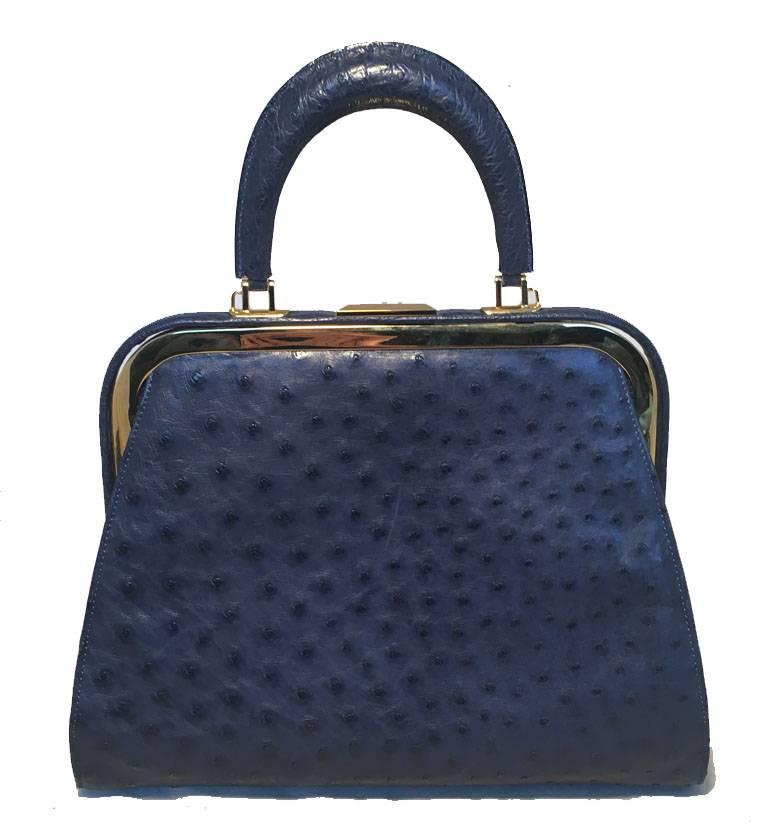 BEAUTIFUL Vintage Siso blue ostrich kelly bag in very good condition.  Blue ostrich leather exterior trimmed with gold hardware and a removable matching blue leather shoulder strap. Top pinch latch closure opens to a black vinyl lined interior that