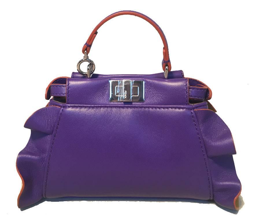 ADORABLE Fendi Micro peekaboo bag in excellent condition.  Mini peekaboo bag style in purple leather with yellow (amber) ruffle leather trim on sides and silver hardware.  Top twist and snap closures open to a grey suede lined interior that holds 1