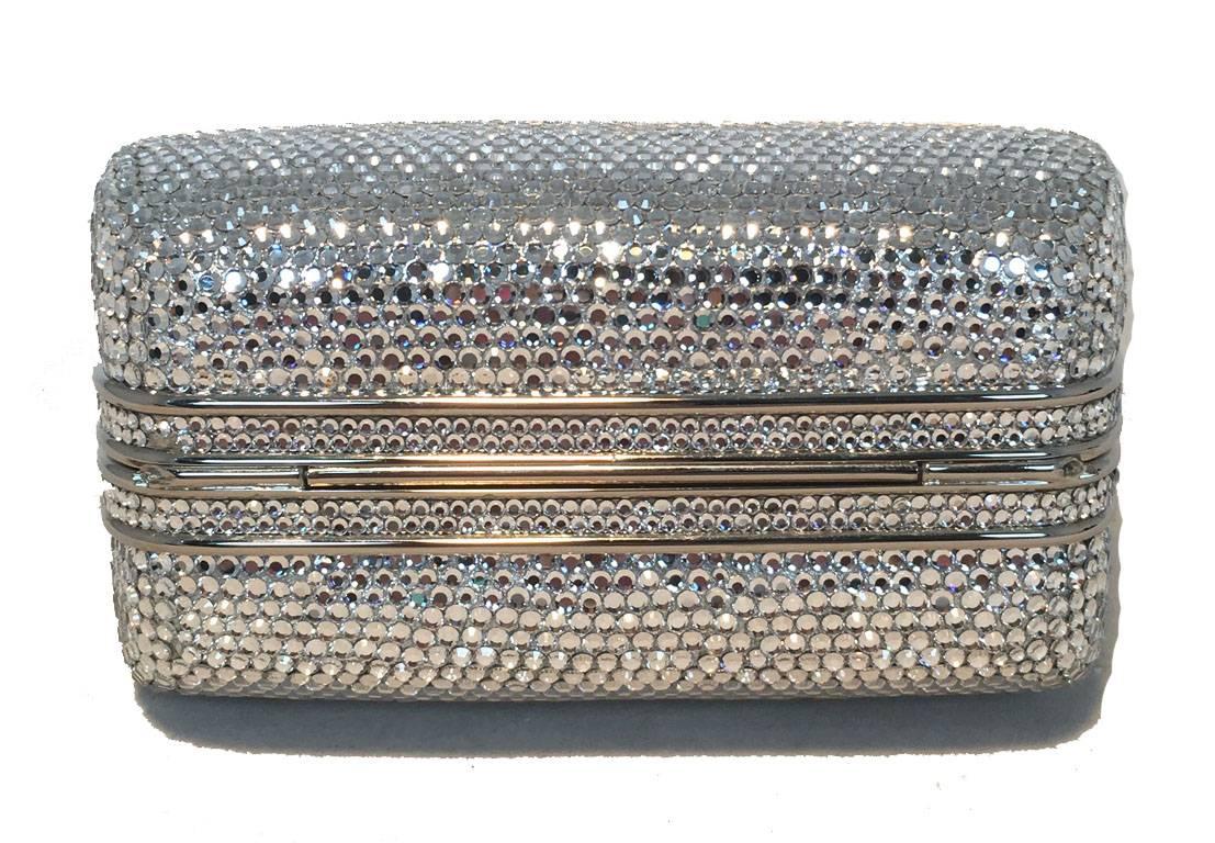 STUNNING Judith Leiber silver swarovski crystal mini purse minaudiere evening bag in excellent condition. Silver swarovski crystal exterior trimmed with silver hardware and a beautiful top large crystal stone.  Lift latch top closure opens to a