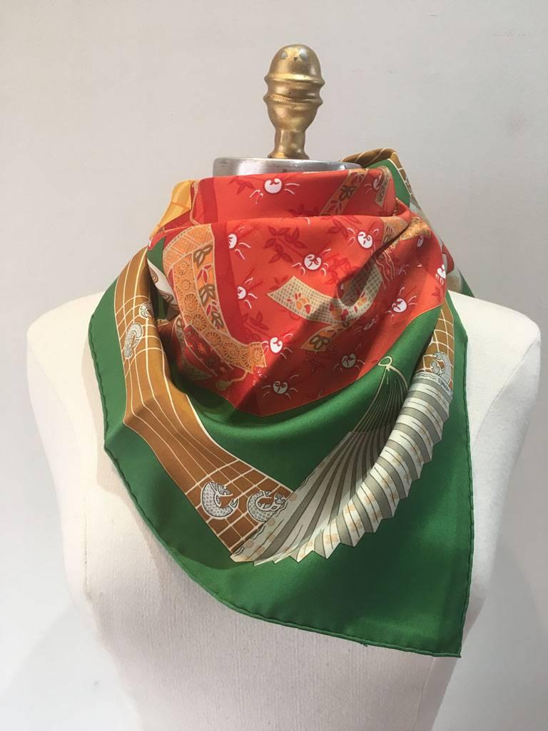 BEAUTIFUL Hermes vintage Kimonos et Intros silk scarf in green in excellent condition.  Original silk screen design c1986 by Annie Faivre features the traditional japanese kimono dress pieces in a variety of colors over a green background.  100%