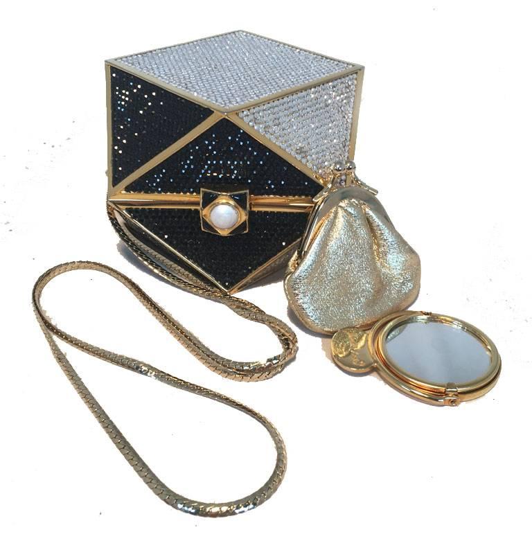 RARE AND AMAZING Judith Leiber geo box minaudiere in excellent condition.  Black and white swarovski crystal exterior trimmed with gold hardware.  Pearl button closure opens to a gold leather lined interior that holds a hidden attached gold chain