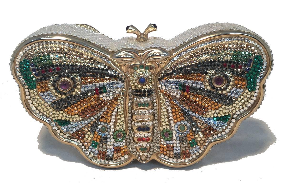 GORGEOUS Judith Leiber swarovski crystal butterfly minaudiere in very good vintage condition.  Swarovski crystal exterior trimmed with gold hardware.  Top magnetic closure opens to a gold leather lined interior that holds an attached gold chain