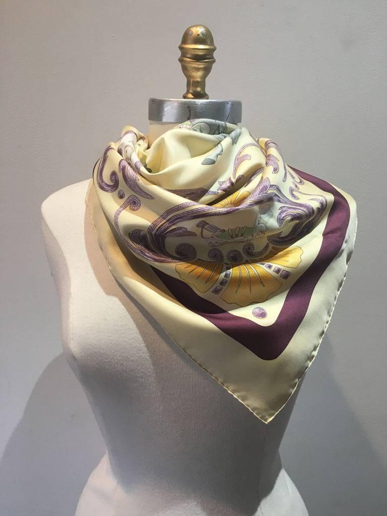 Beautiful Vintage Cheval Turc silk scarf in excellent condition.  Original silk screen design circa 1969 by Christiane Vauzelles features a gorgeous centered horse design with an ornate purple detailed border over a beige background with a beige and
