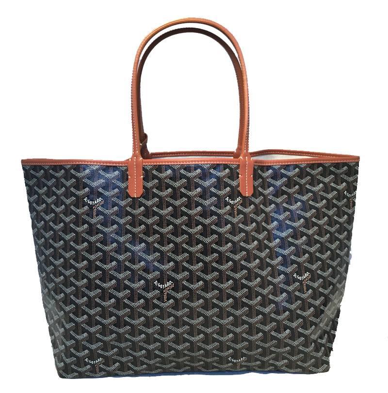 Classic Goyard St Louis PM tote in excellent condition. Black monogram canvas exterior trimmed with tan leather. Linen lined interior with ample storage space and a removable 7.5"x4" wallet pouch. Excellent condition, no stains, smells, or