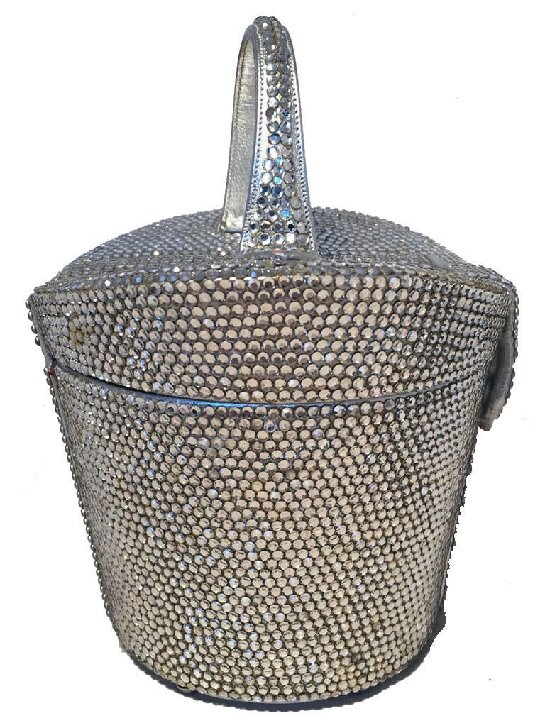STUNNING Judith leiber Swarobvskli crystal basket evening bag in very good vintage condition.  Worn by Rihanna at the 2018 Met Gala. Silver swarovski crystal exterior in unique basket shape perfect for any special occasion.  Front snap closure opens