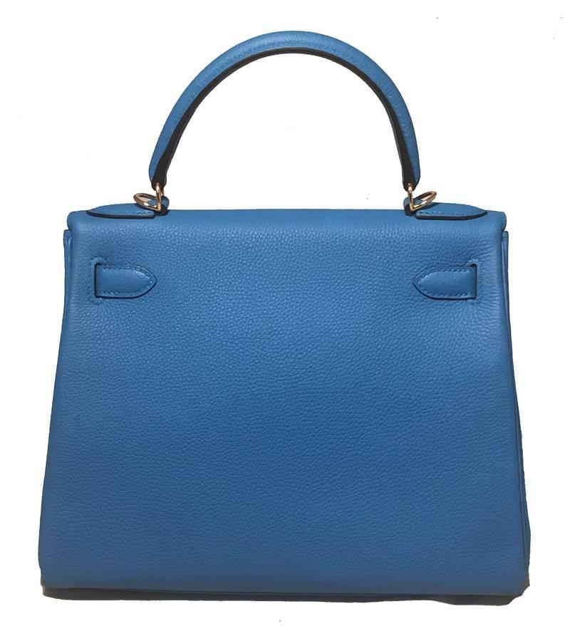 DROP DEAD GORGEOUS NEW Hermes Zanzibar blue togo leather 28cm kelly in new excellent condition. RARE Zanzibar blue togo leather body with gold hardware trim.  Plastic still wrapped around name plate & strap hardware and protective felt included